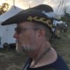 Ken wearing his comet brooch in his hat.