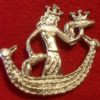 A crowned woman in a boat holding a crowned penis in one hand and with the other hand on a penis that serves as a rudder.