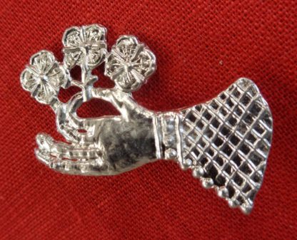 Hand Holding a Flower Brooch - Image 3