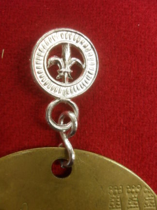 Charm holder withfleur de lis