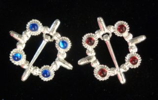 Cock ring brooches, blue and red