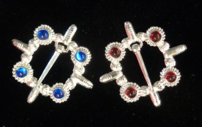 Cock ring brooches, blue and red