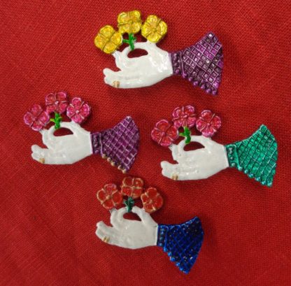 Hand Holding a Flower Brooch - Image 2