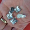 Five knucklebones held in the palm of a hand