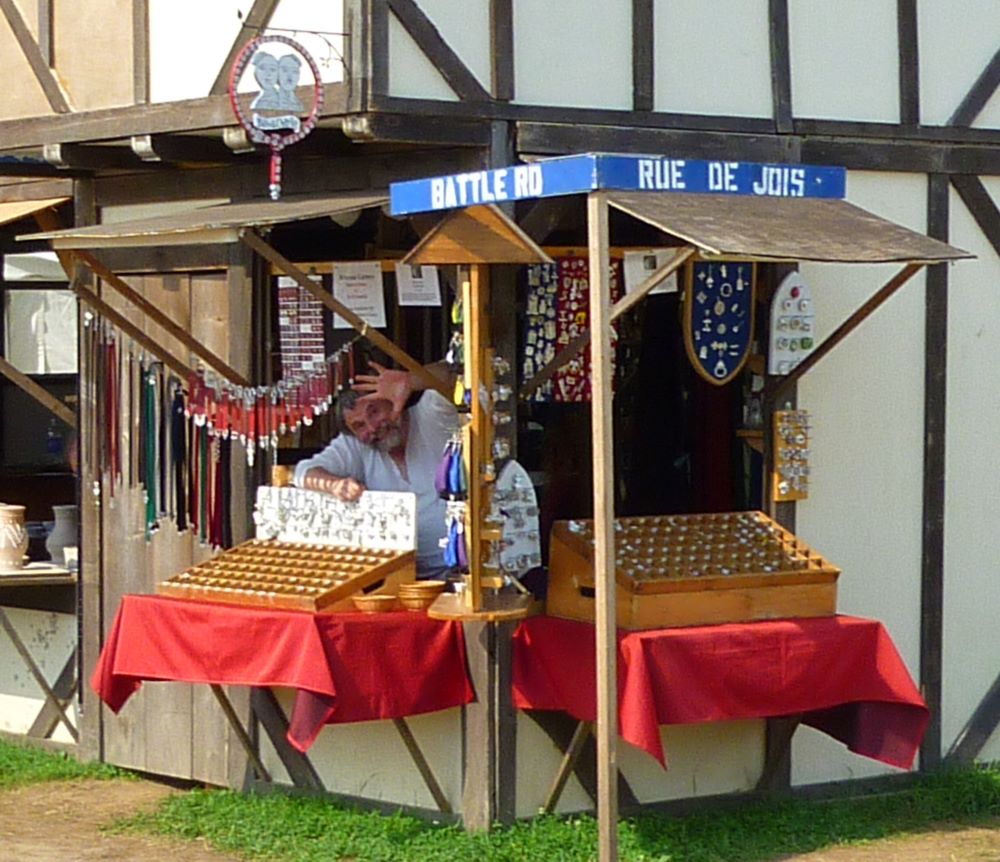 Mac waving from shop at Pennsic