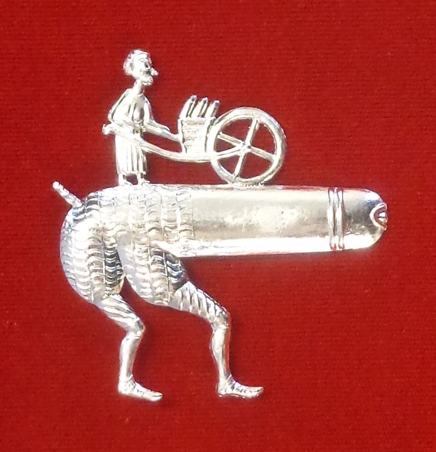 Clara Brooch - a woman pushed a barrow on top of a giant penis.