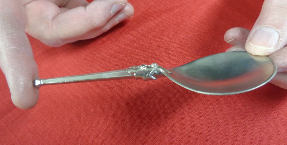 Folding spoon open and locked
