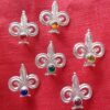 Fleur de lis brooches with stones