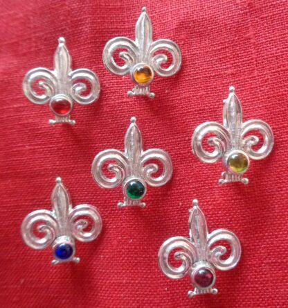 Fleur de lis brooches with stones