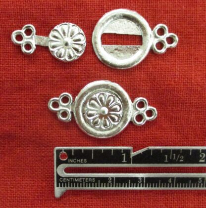 interlocking clasp shown with a ruler