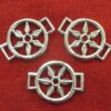 three chaplet decorations with openwork star, one shown from the back