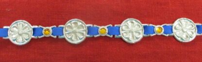 Flower chaplet decoration, alternating with yellow stones, on a ribbon