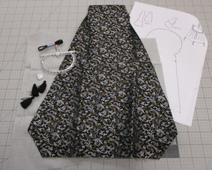 Contents of a kit to make a large purse in a black and silver brocade fabric
