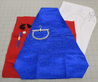 Contents of a kit to make a large purse in blue brocadew