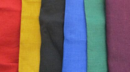 The slection of plain linen available in purse kits: red, yellow, black, blue, green, purple