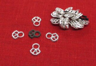 Filigree eyelets showin individually with the original exemplar and in a bundle, as sold