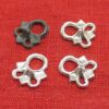 Original exemplar and three of our copies of the pointy eyelets mold