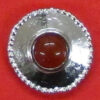 button with red brown stone