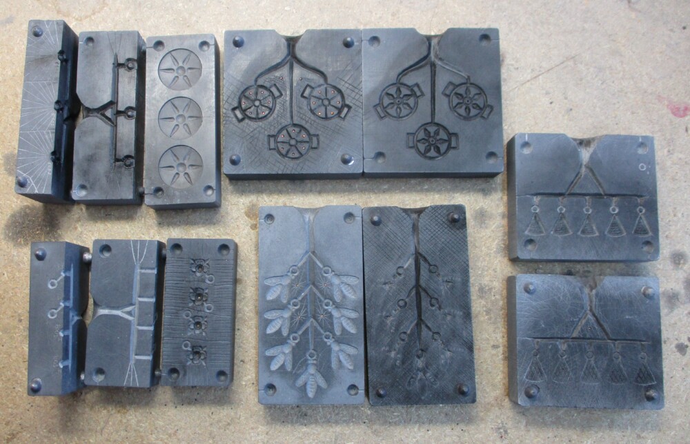 Multiple cavity molds: button, circlet decoration, spangle with stone, bee spangle, and triangular spangle