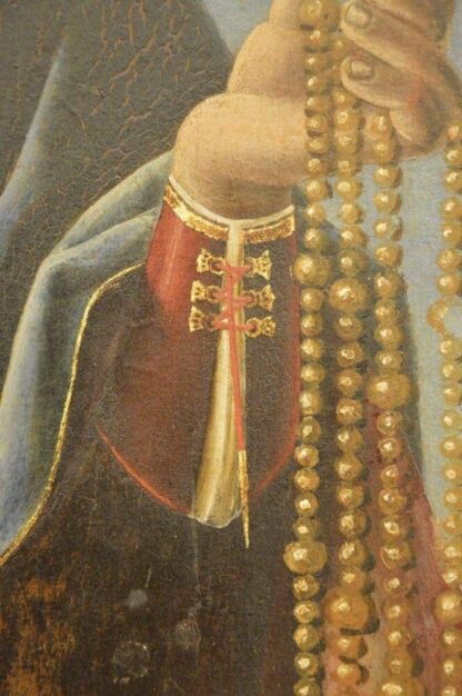 Detail of a painting, c.1500, showing six similar eyelets used for lacing a sleeve closed at the wrist