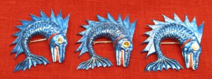 3 dolphin badges painted blue