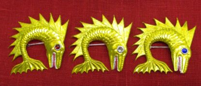 3 dolphin badges painted yellow