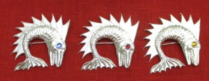 3 unpainted dolphin badges