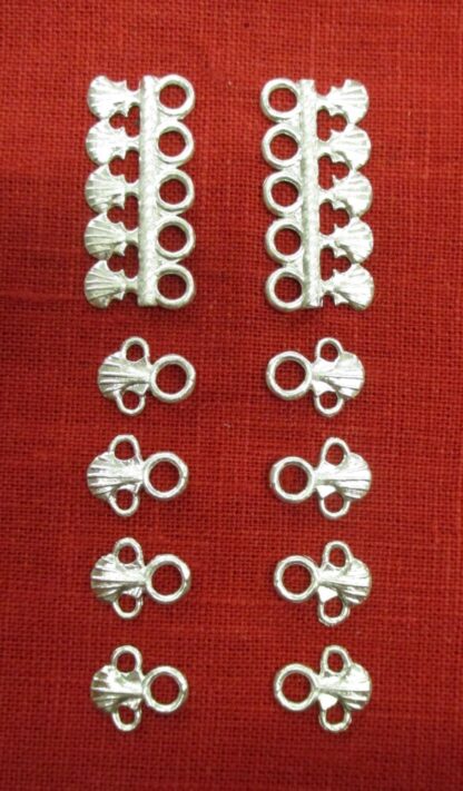 Pair of eyelet bars and 8 lacing eyelets with shells