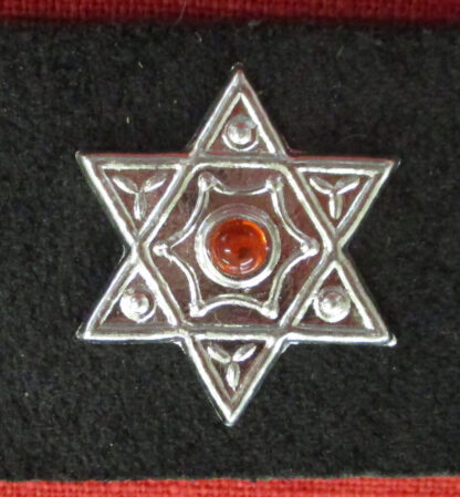 hexagram stud with orange stone