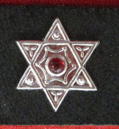 hexagram stud with red stone