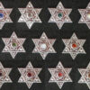 Eleven hexagonal studs showing the available colors