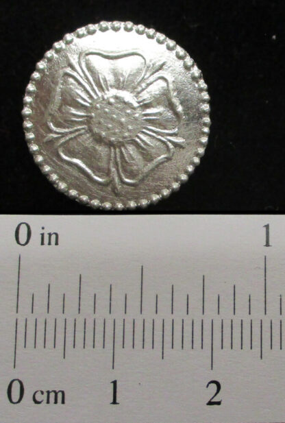 The 3/4" rose button shown with a scale