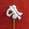Detail of the head of the pelican veil/wimple pin