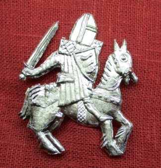 Brooch of an armored knight on horseback, wielding a sword.