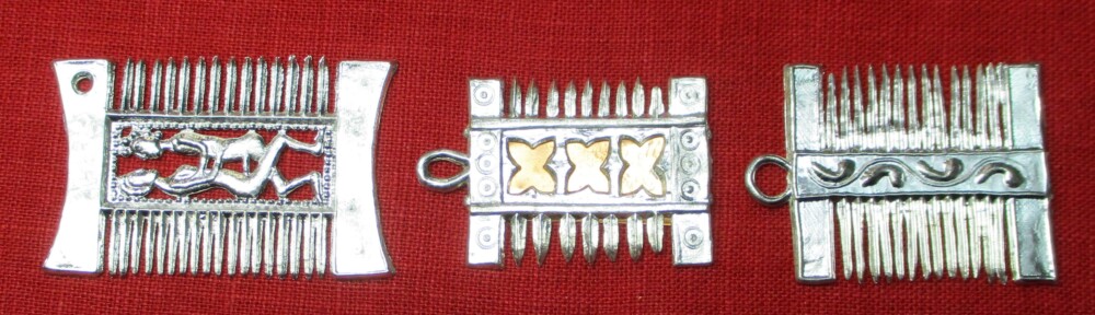 Three similar pendant combs with differing decoration in the middle between the teeth: the first with a scene of heterosexual intercourse; the second with an openwork decorative design; the third with a number of penises arranged along a ribbon