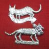 Two similar depictions of a cat carrying something in its mouth - in one case a mouse; in the other a penis.