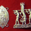 A mandorla shape with an image of the Virgin Mary holding the Christ child. Beside it, three penises wiht legs carry a vulva on a litter.