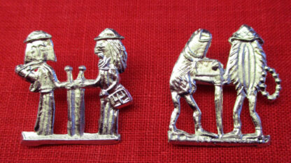 Two brooches showing a male and female pilgrim. One has human figures; in the other the pilgrims are a penis and a vulva.