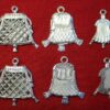 Front and back images of three similar pendant purses. The first is an openwork drawstring purse and contains a pretend coin. The second looks like a closed frame purse on one side; the other side reveals it contains three penises. The third is a small, closed frame purse.