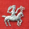 Three similar figures on horseback carrying crossbows. The riders are a penis, a man, and a vulva