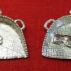 Two similar winnowing fans, one with an inset flower, one with an inset three-dimensional scene of sexual intercourse