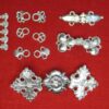 Our clothing fasteners, including lacing eyelets and bars, paired hooks, interlocking fasteners, and dress hooks