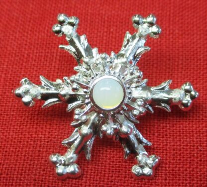 Snowflake brooch with opal glass stone