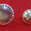 small and medium pearled buttons, showing faces