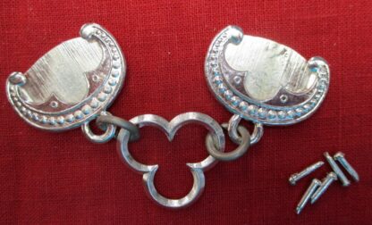 Two chapes linked by a trefoil, with five rivets
