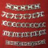 Sets of five links for the letters S, A, E, M. Also, the collar links in the shape of long openwork bars