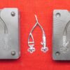 Front and back mold pieces for the "Handy" hooks and eyes with a sprued casting