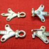 2 pairs of bee hooks and eyes, open, and with one of the hook units shown upside down displaying hook