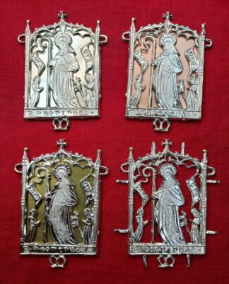 The pilgrim sign for St. Gertrude, shown with pewter, copper, and brass sheet backings, and with no backing.