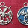 The pilgrim sign for St. Michael, shown with no backing and with a paper backing